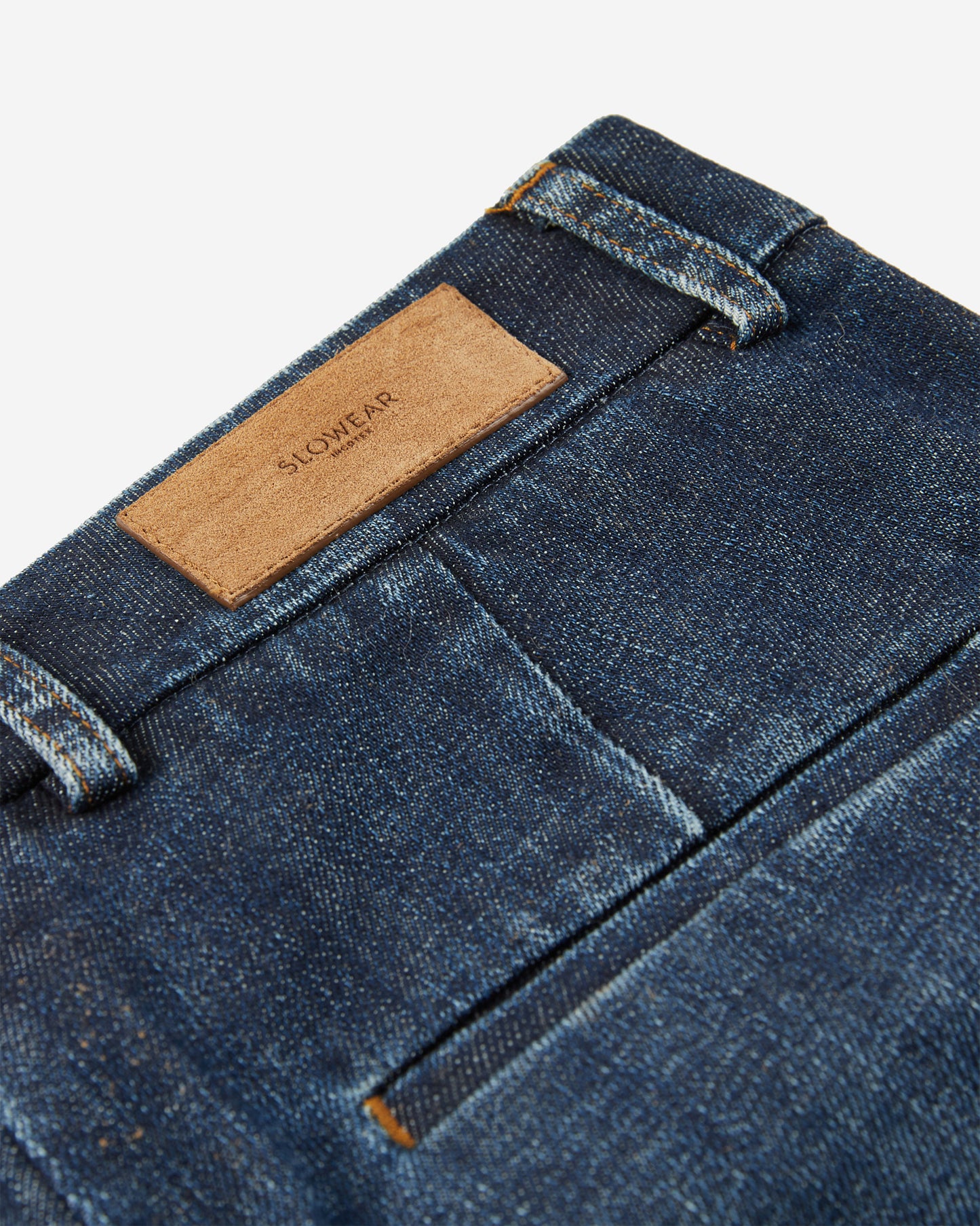 Stretch denim slim fit trousers