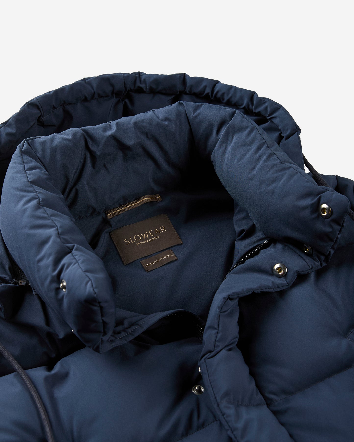 Piumino lungo in tessuto tecnico e imbottitura